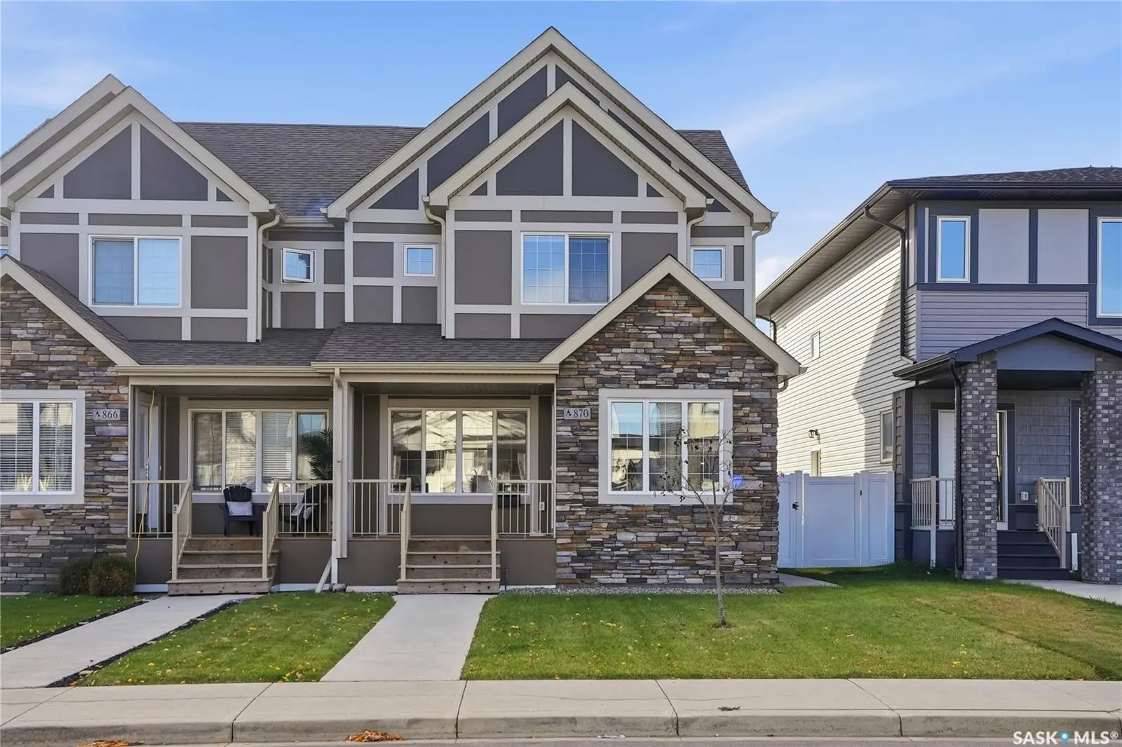 Exterior photo of 870 McFaull Rise, Saskatoon SK — modern 2-storey Ehrenburg-built home with stone and siding in Brighton.